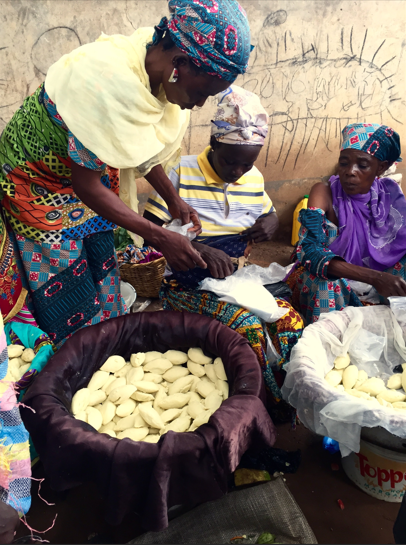 Ghana women with food and cleaning pic