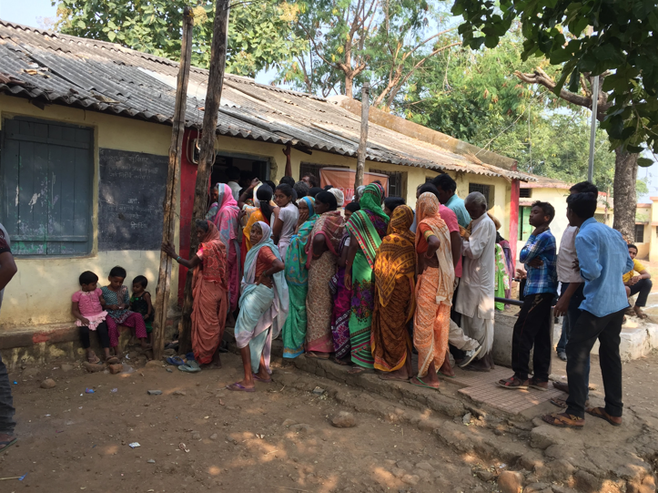 India people in line outside building pic